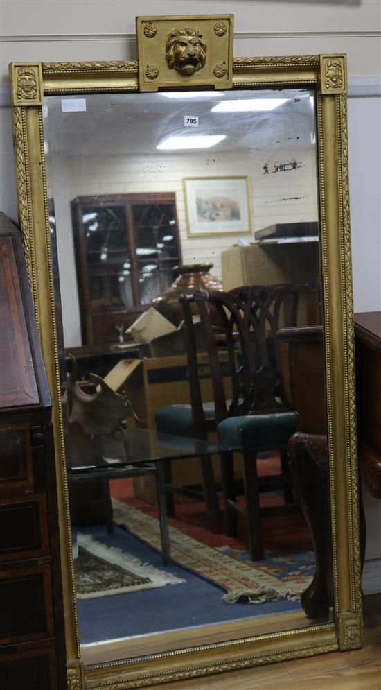 A gilt framed mirror with lion mask top W.74.5cm